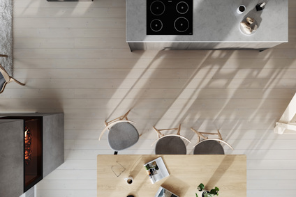 Modernt kök med spishäll, ö och bord med stolar, sedd från ovan. Skuggor synliga på golvet.