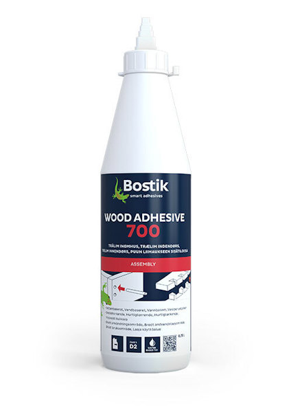 Vit flaska med Bostik Wood Adhesive 700 etikett, röd och blå text, skruvlock.