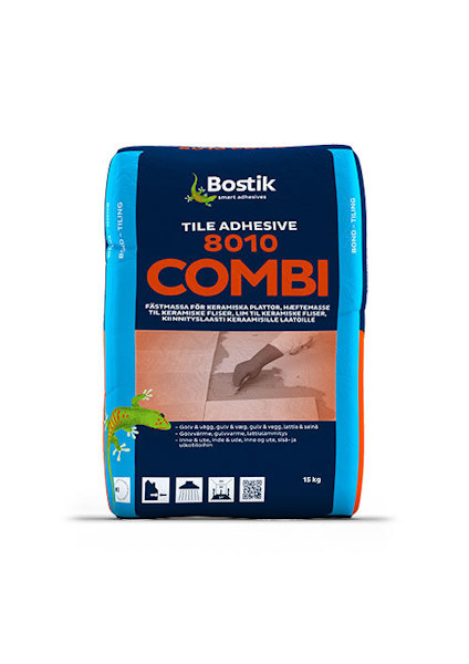 Blå och orange påse med texten "Bostik Tile Adhesive 8010 Combi" och bild av en murslev som sprider kakellim.