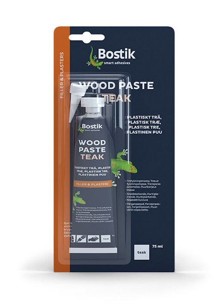 Förpackning av Bostik Träfiller Wood Paste Teak i tub på 75 ml med produktinformation och illustration av en grön ödla.