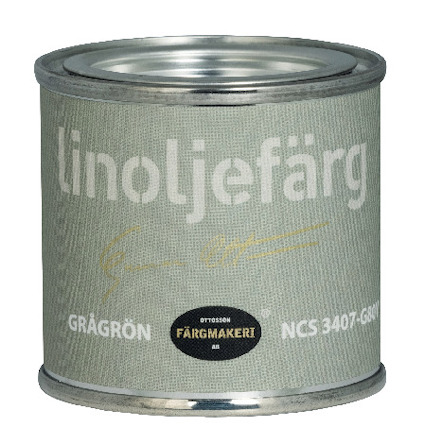 Grön plåtburk med texten "linoljefärg" och "GRÅGRÖN" samt logotyp för Ottosson Färgmakeri AB.
