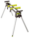 Hopfällbart arbetsbord från Ryobi med metallben, grön och svart ram och hållare för arbetsmaterial.