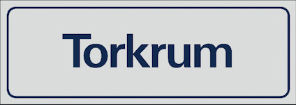 Rektangulär skylt med texten "Torkrum" i blått mot en ljusgrå bakgrund.