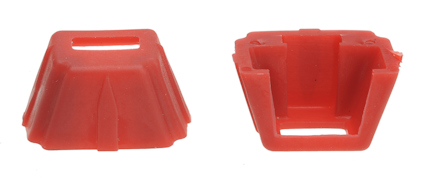 Två orangea plastkåpor, en syns från ovansidan och den andra är vänd upp och ner.