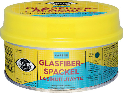 Rund, gul burk med texten "GLASFIBERSPACKEL LASIKUITUTÄYTE" och blå etikett med marint tema.