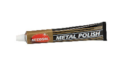 Tandformad tub med svart, guld och vit etikett märkt "Autosol Metal Polish".