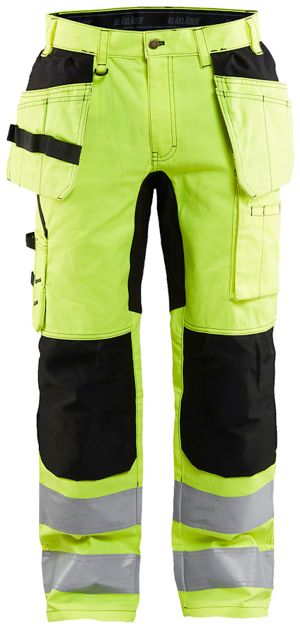 Arbetsbyxor i neon-gul och svart med reflexband på benen och flera fickor.