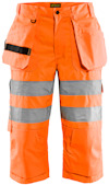 Orange piratbyxor i slitstarkt material med reflexdetaljer och flera fickor.