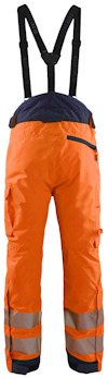 Orange arbetsbyxor med svarta hängslen och reflexband vid knäna. En bakficka med dragkedja syns.