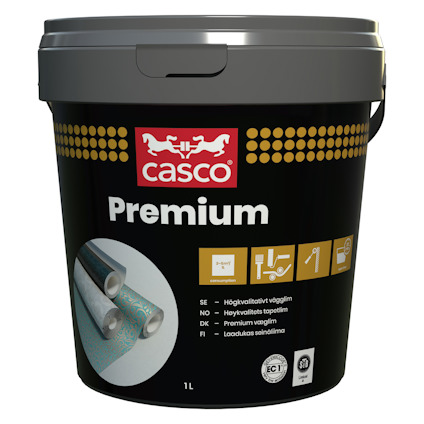 Hink med Casco Premium vägglim, svart etikett med gyllene detaljer och instruktioner i flera språk.