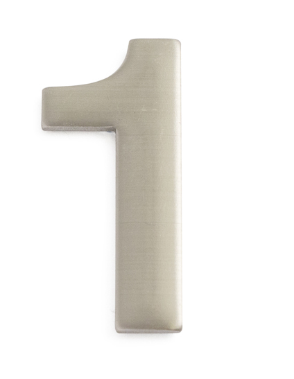 Siffra "1" i metalliskt material mot vit bakgrund.