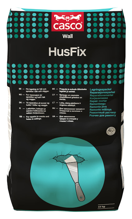 Påsen har texten "Casco HusFix Wall" med en illustration av en spackelspatel och en uppsprucken vägg.