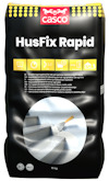 Förpackning av Casco HusFix Rapid 10 kg med text och bild på spackelverktyg och trappa.