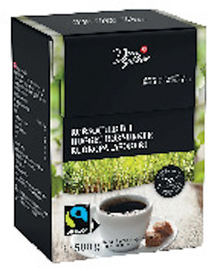 Förpackning med rörsockersbitar, märkt med Fairtrade-symbol och text på flera språk, inklusive svenska och finska.