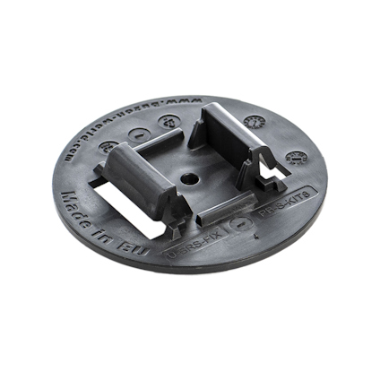 Rund svart adapter med text "Made in EU" och "WWW.DURASOL-ONLINE.COM", samt utskjutande delar på ovansidan.