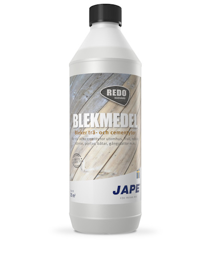 Vit flaska med svart kork och etikett med texten "Redox Blekmedel" och "Jape".