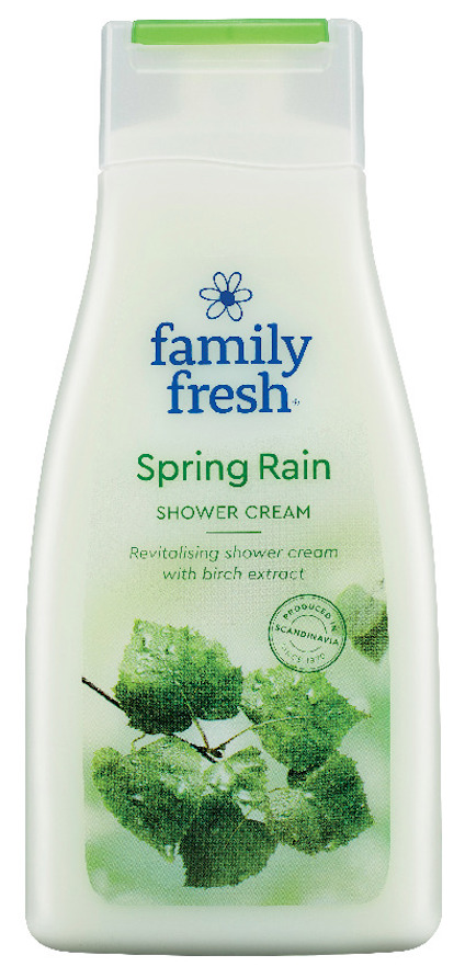 Vit flaska med grönt lock, märkt "Family Fresh Spring Rain Shower Cream" med bild på gröna löv.