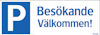 Skylt med blå bakgrund och texten "P Besökande Välkommen!" i vitt och blått.