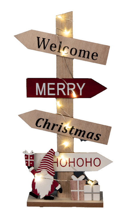 Trästolpe med ljussatta skyltar som säger "Welcome", "Merry", "Christmas" och "HO HO HO". dekorativ tomte och presenter längst ner.