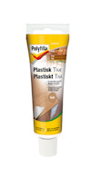 Tub med plastiskt trä av märket Polyfilla, etikett i gult och brunt med texten "Plastiskt Trä Teak".