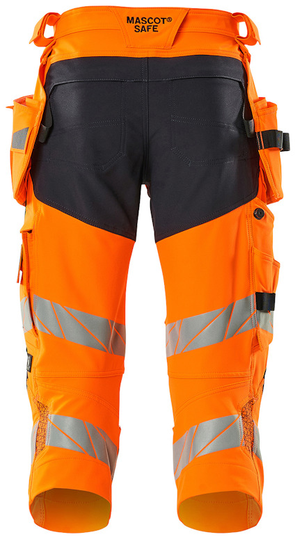Orange arbetsbyxor med knälångt snitt, reflexband och svarta detaljer. Märket "MASCOT SAFE" syns upptill.