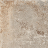 Granitkeramik med en beige och brun fläckig yta och textur.