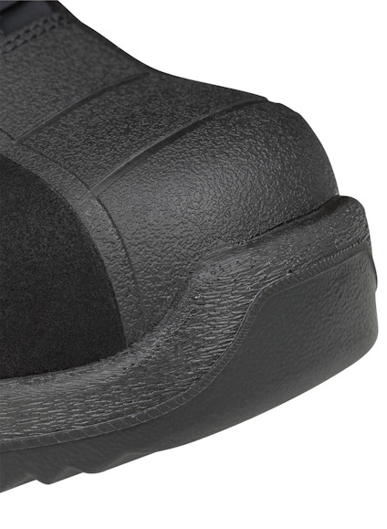 Svart sula med textur och svagt böjd form, detaljerad yta synlig.