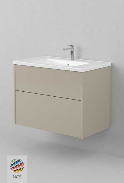 Vägghängd kommod med två lådor i en beige färg och vitt handfat ovanpå.
