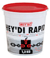 Vit hink med röd lock, märkt "HEY'DI RAPID". Text på flera språk och illustration med kedja och svart block.