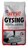 Förpackning av Hey'di Gysing Häftslamma 15 kg med illustration av borste som sprider grå massa på marken.