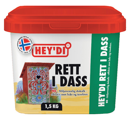 Förpackning med etikett "HEY'DI RETT I DASS", dekorerad med en bild av ett utsmyckat utedass och norsk flagga.