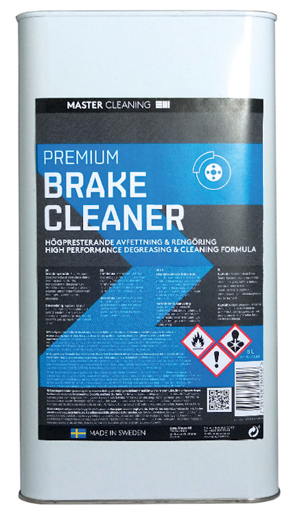 Rektangulär vit metallbehållare med etikett "Premium Brake Cleaner" och varningssymboler.