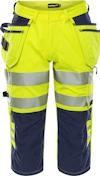 Varselbyxa med trekvartsben i gult och marinblått, reflexband och flera fickor.
