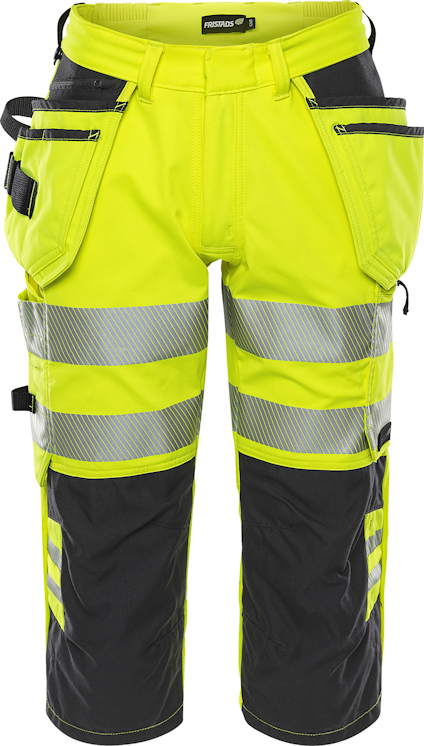 Varselbyxor i gult och svart med reflexband runt benen. Flera fickor är synliga framtill.