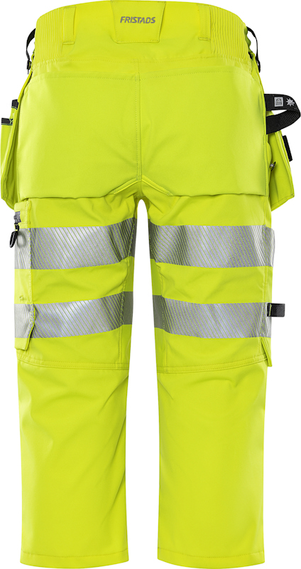 Gula arbetsbyxor med reflexband och flera fickor, bakifrån. Märkt "Fristads" vid midjan.