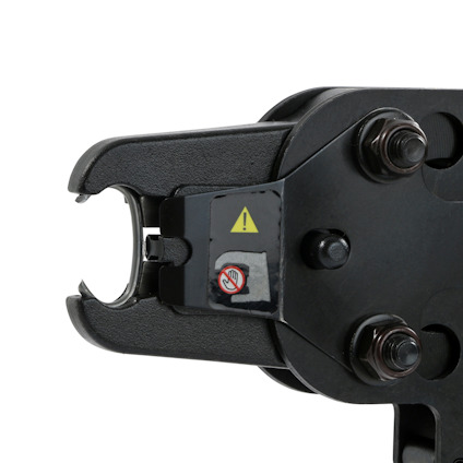 Hydrauliskt verktygshuvud med metallskruvar och varningssymbol.