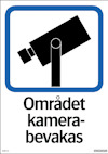 Skylt med en stiliserad kameraikon och texten "Området kamerabevakas" i svart.