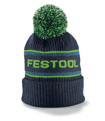 Svart mössa med tofs och texten "FESTOOL" i grönt. Blå och gröna ränder ovanför texten.