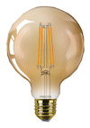 En glödlampa med guldfärgad sockel och filament synliga inuti det genomskinliga glaset.