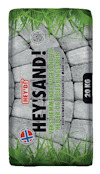 Förpackning med stenar som bakgrund, texten "HEY'SAND! HEY'DI" och "20 KG" samt gräsmönster i hörnen.