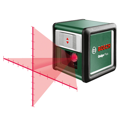 Grön Bosch Quigo Plus krysslaser som projicerar ett rött kors med markeringar.
