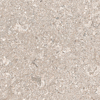 Granitkeramik i en ljusbeige ton med mönster av spräckliga fläckar och fossilliknande detaljer.