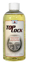 Gul flaska med vit kork och etikett med texten "TOPOCK". Etiketten har även bild av ett avloppsgaller.