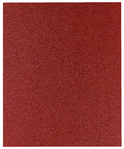 Rödbrunt sandpapper med en kornig textur.