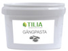 Vit plastburk med etiketten "Tilia Gängpasta" och en bild av gängtappar.