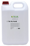 Vit behållare med rött lock och etikett med texten "Skärolja" och Tilia-logotypen. Kapacitet: 5 liter.