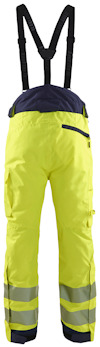 Gula arbetsbyxor med svarta hängslen och reflexdetaljer på benen.