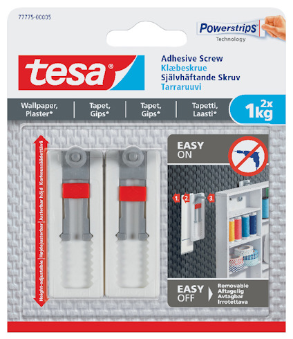 Förpackning med två självhäftande skruvar av märket "tesa", med instruktioner och logotyp på framsidan.