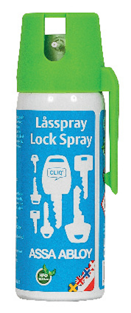 Sprayburk med grön kork och etikett som visar nycklar och texten "Låsspray Lock Spray ASSA ABLOY".