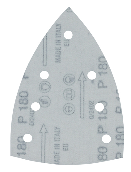 Slippapper med spetsig form, åtta runda hål och tryckt text inklusive symboler.